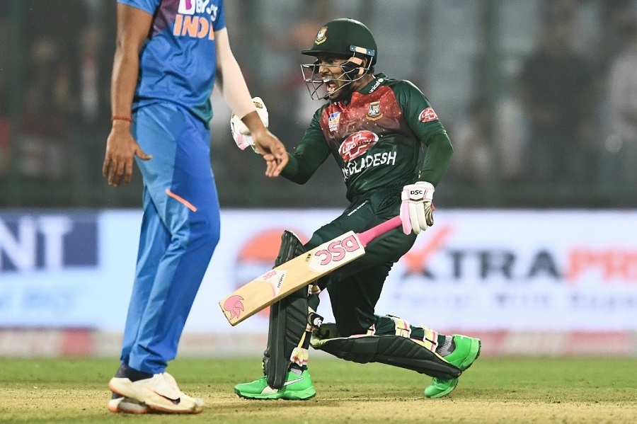 Bangladesh's Mushfiqur Rahim (R) celebrates his victory at the end of the first T20 international cricket match of a three-match series between Bangladesh and India, at Arun Jaitley Cricket Stadium in New Delhi on November 3, 2019. 