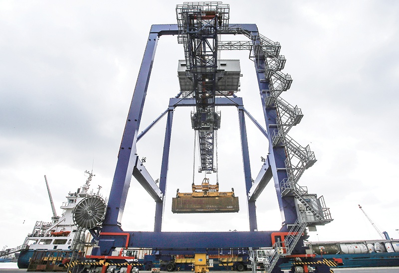 (FILES) In this file photo taken on October 05, 2018 a container ship is unloaded at the Port of Immingham operated by Associated British Ports (ABP) on the south bank of the Humber Estuary, eastern England. - Maritime freight volumes have dropped in the last year due to protectionism and the weakening of international commerce according to a report released on October 30, 2019. (Photo by LINDSEY PARNABY / AFP)