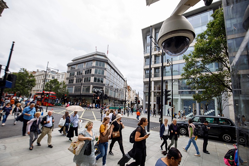 LONDON: People walk past a CCTV camera operating on Oxford Street on Aug 16, 2019. – AFP  