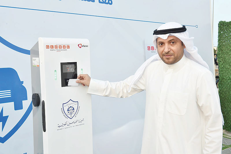 KUWAIT: Dr Bader Al-Twayel, Head of the Sustainable Energy Committee at the Kuwait Society of Engineers, demonstrates the first public charging station for electronic vehicles at the KSE headquarters in Bneid Al-Gar yesterday. - Photo by Yasser Al-Zayyat