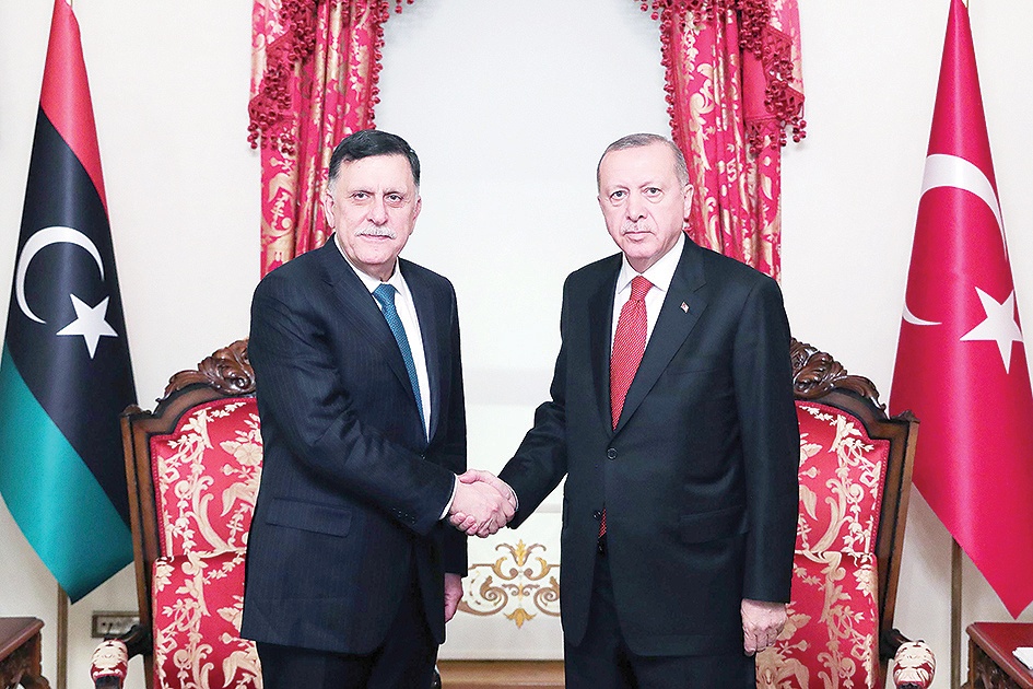 ISTANBUL: Turkish President Recep Tayyip Erdogan (right) shakes hands with Fayez Al-Sarraj, the head of the Tripoli-based Government of National Accord (GNA), during their meeting on Wednesday. - AFP 
