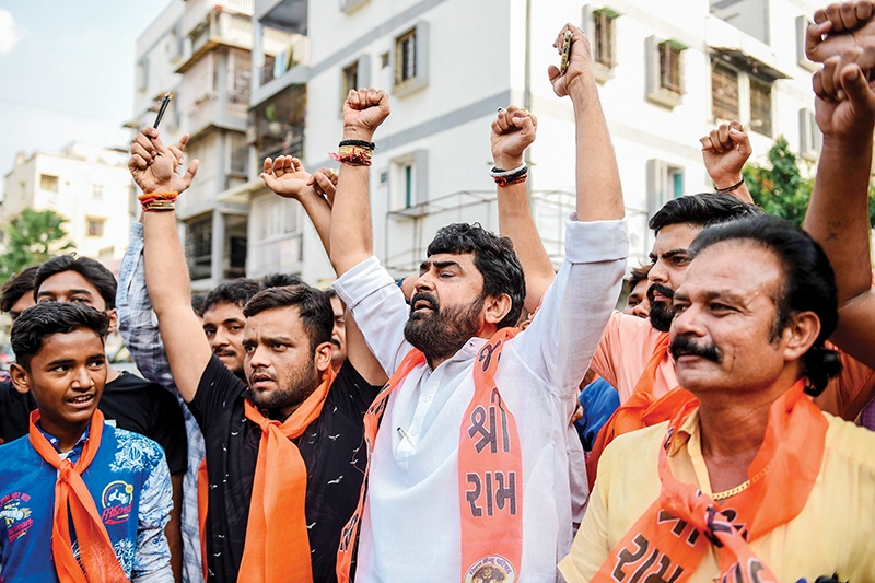Supporters of the Vishwa Hindu Parishad (VHP) militant organisation celebrate the Indian Supreme Court's verdict on disputed religious site in Ayodhya awarded to Hindus, in Ahmedabad on November 9, 2019. - India's top court handed a huge victory to Prime Minister Narendra Modi's Hindu nationalist party on November 9 by awarding Hindus control of a bitterly disputed holy site that has sparked deadly sectarian violence in the past. (Photo by SAM PANTHAKY / AFP)