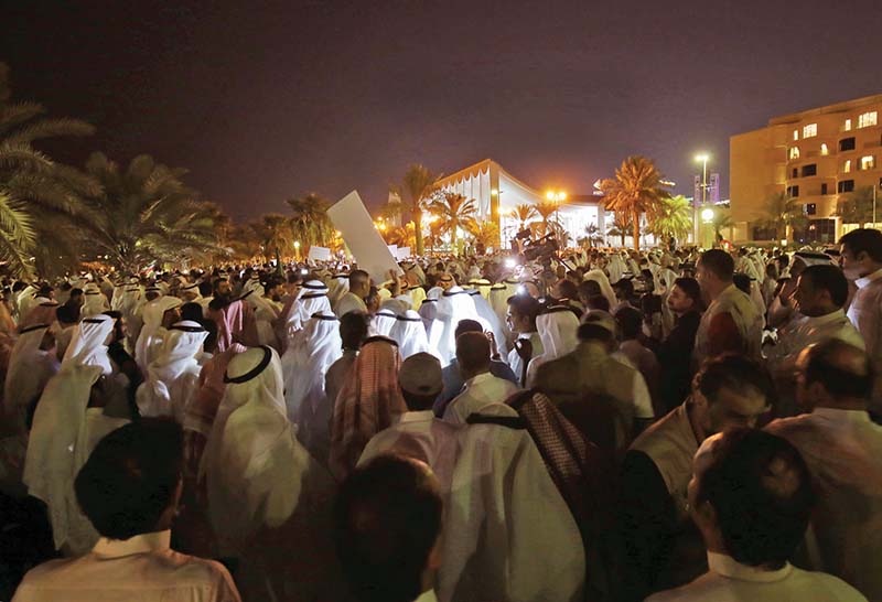 Kuwaiti demonstrators take part in a demonstration against corruption in Kuwait City on November 6, 2019. - Hundreds protested in front of Kuwait's parliament on Wednesday evening against the state's perceived unwillingness to fight corruption, in a country where such events have periodically triggered political crises. (Photo by Yasser Al-Zayyat / AFP)