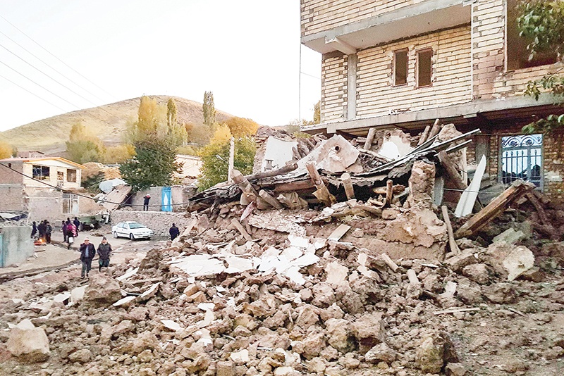 TOPSHOT - A picture obtained by AFP from Iranian news agency Tasnim on November 8, 2019 shows the debris of buildings in the Iranian village of Varnakesh, about 120 kilometres (75 miles) southeast of the city of Tabriz, in East Azerbaijan Province, following a 5.9-magnitude earthquake. - A night-time earthquake in northwestern Iran on Friday killed five people and injured 120, according to early reports on state television. The country has suffered a number of major disasters in recent decades, including at the ancient city of Bam, which was decimated by a catastrophic earthquake in 2003 that killed at least 31,000 people. (Photo by Mohammad ZEINALI / TASNIM NEWS / AFP)