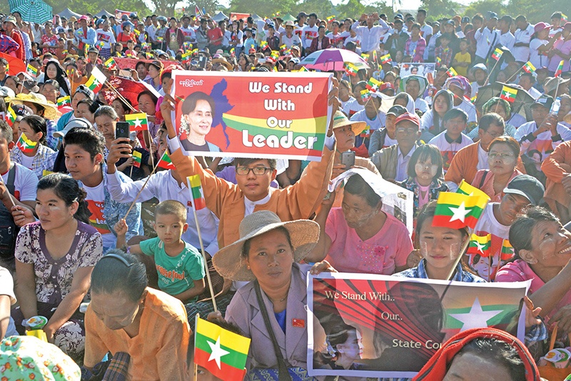 NAYPYIDAW, Myanmar: People participate in a rally in support of Myanmar State Counsellor Aung San Suu Kyi yesterday ahead of her appearance at the International Court of Justice to defend the country against charges it committed genocide against Rohingya Muslims. - AFP