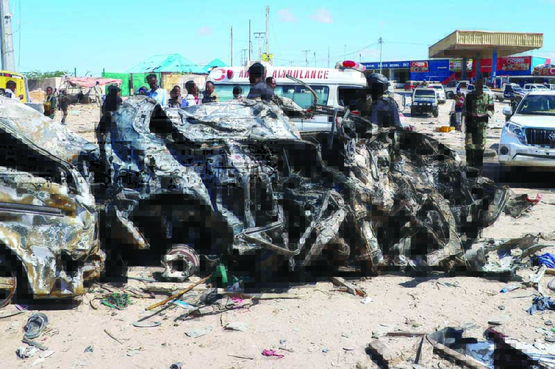 TOPSHOT - The wreckage of a car that was destroyed during the car bomb attack is seen in Mogadishu, on December 28, 2019. - A massive car bomb exploded in a busy area of Mogadishu on December 28, 2019, leaving at least 76 people dead, many of them university students. (Photo by Abdirazak Hussein FARAH / AFP)