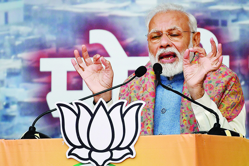 India's Prime Minister Narendra Modi speaks during a rally in New Delhi on December 22, 2019. - Modi fired up delirous party supporters on December 22 as a wave of protests and clashes that has killed at least 25 put the Indian leader and his Hindu nationalist government under pressure like never before. (Photo by Prakash SINGH / AFP)