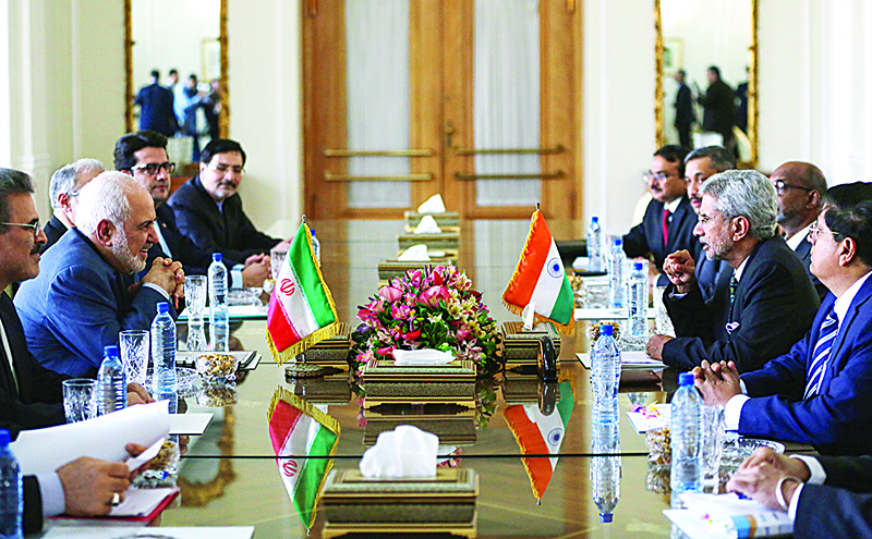 Iran's Foreign Minister Mohammad Javad Zarif (L) listens to his Indian counterpart Subrahmanyam Jaishankar during bilateral talks in the capital Tehran, on December 22, 2019. (Photo by ATTA KENARE / AFP)