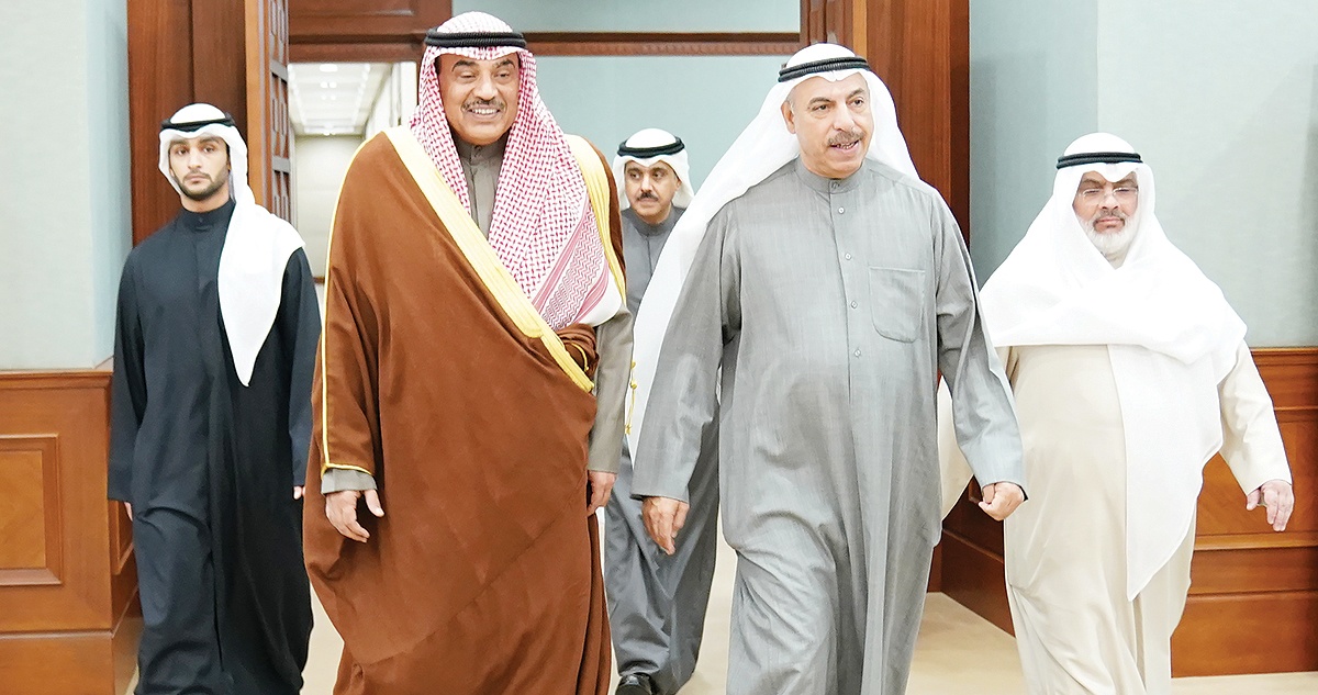 KUWAIT: HH the Prime Minister Sheikh Sabah Al-Khaled Al-Sabah meets Audit Bureau chief Faisal Al-Shaye and his deputy Abdulaziz Al-Saraawi yesterday during a visit to the Audit Bureau. – KUNA 