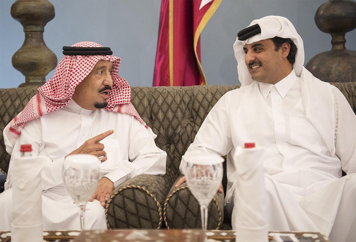 Saudi King Salman chatting with Qatari Emir Sheikh Tamim bin Hamad al-Thani in 2016 