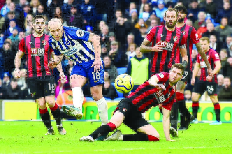 Brighton's Dutch midfielder Aaron Mooy (2R) scores his team's second goal during the English Premier League football match between Brighton and Bournemouth at the American Express Community Stadium in Brighton, southern England on December 28, 2019. (Photo by Glyn KIRK / AFP) / RESTRICTED TO EDITORIAL USE. No use with unauthorized audio, video, data, fixture lists, club/league logos or 'live' services. Online in-match use limited to 120 images. An additional 40 images may be used in extra time. No video emulation. Social media in-match use limited to 120 images. An additional 40 images may be used in extra time. No use in betting publications, games or single club/league/player publications. /