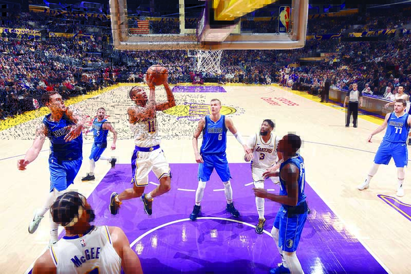 LOS ANGELES, CA - DECEMBER 29: Avery Bradley #11 of the Los Angeles Lakers drives to the basket during the game against the Dallas Mavericks on December 29, 2019 at STAPLES Center in Los Angeles, California. NOTE TO USER: User expressly acknowledges and agrees that, by downloading and/or using this Photograph, user is consenting to the terms and conditions of the Getty Images License Agreement. Mandatory Copyright Notice: Copyright 2019 NBAE   Andrew D. Bernstein/NBAE via Getty Images/AFP