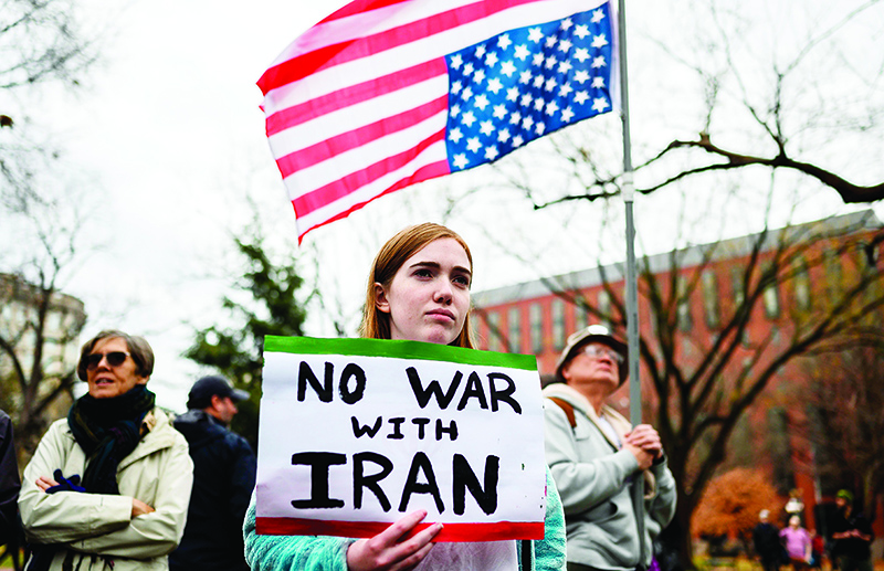 TOPSHOT - Anti-war activist protest in front of the White House in Washington, DC, on January 4, 2020. - Demonstrators are protesting the US drone attack which killed Iran's Major General Qasem Soleimani in Iraq on January 3, a dramatic escalation in spiralling tensions between Iran and the US, which pledged to send thousands more troops to the region. (Photo by ANDREW CABALLERO-REYNOLDS / AFP)