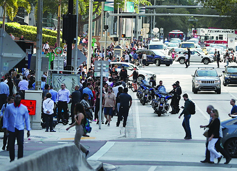 MIAMI, FLORIDA - JANUARY 28: People wait outside after evacuating office buildings after an earthquake struck south of Cuba on January 28, 2020 in Miami, Florida. The magnitude 7.7 earthquake struck northwest of Jamaica, according to the U.S. Geological Survey.   Joe Raedle/Getty Images/AFPn== FOR NEWSPAPERS, INTERNET, TELCOS &amp; TELEVISION USE ONLY ==