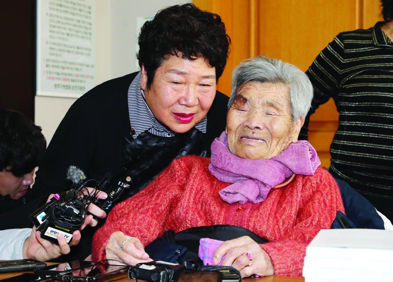 Family members of Chang Hwan-bong, who was among hundreds of people who were accused of helping left-leaning soldiers in an armed uprising against the South Korean government in the southwestern cities of Yeosu and Suncheon in 1948, speak to reporters after the trial at the Suncheon branch of the Gwangju District Court in Suncheon on January 20, 2020. - A South Korean court on January 20 posthumously exonerated a man executed more than 70 years ago for assisting rebel forces, saying he had been wrongly convicted. (Photo by - / YONHAP / AFP) / - South Korea OUT / REPUBLIC OF KOREA OUT  NO ARCHIVES  RESTRICTED TO SUBSCRIPTION USE