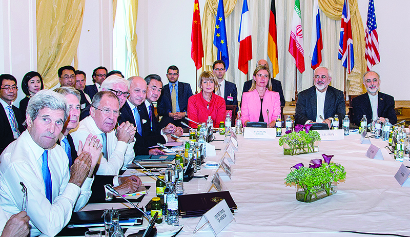 (FILES) This file photo taken on July 6, 2015 shows (L-R) then US Secretary of State John Kerry, then British Foreign Minister Philip Hammond, Russian Foreign Minister Sergey Lavrov, then German Foreign Minister Frank-Walter Steinmeier, then French Foreign Minister Laurent Fabius, China's Foreign Minister Wang Yi, EU Secretary General for the External Action Service Helga Schmid, then High Representative of the European Union for Foreign Affairs and Security Policy Federica Mogherini, Iranian Foreign Minister Mohammad Javad Zarif and Iran's ambassador to IAEA, Ali Akbar Salehi, as they meet at Palais Coburg Hotel, where the Iran nuclear talks meetings were being held, in Vienna, Austria. - The 2015 nuclear deal between Iran and world powers has been left in tatters after Tehran on January 5 2020 announced a further rollback of its commitments under the landmark accord following the US assassination of Iranian top general Qasem Soleimani. (Photo by Joe KLAMAR / AFP)