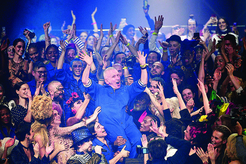 TOPSHOT - French designer Jean Paul Gaultier (C) celebrates with models at the end of his Women's Spring-Summer 2020 Haute Couture collection fashion show in Paris, on January 22, 2020. - Legendary French designer Jean-Paul Gaultier is set to retire from fashion after a typically spectacular show in Paris on January 22, 2020. The maverick creator stunned fans on January 17, by announcing that the haute couture show in a theatre in the French capital would be his last. (Photo by Anne-Christine POUJOULAT / AFP)