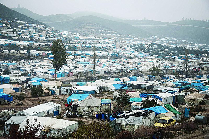 (FILES) In this file photo taken on December 12, 2019 shows a view of tents at a camp for displaced Syrians at Khirbet al-Joz in the west of the northwestern Idlib province near the border with Turkey, where residents survive mostly on aid and barely have enough money to buy food and clothes to keep warm. - UN Security Council members held an intensive round of meetings January 3, 2020 on the humanitarian crisis in Syria's embattled Idlib province amid calls to reauthorize urgently needed cross-border aid.nHumanitarian aid currently flows into northwestern Syria -- a last rebel stronghold -- through UN-designated checkpoints in Turkey and Iraq without Damascus's formal permission. (Photo by Aaref WATAD / AFP)