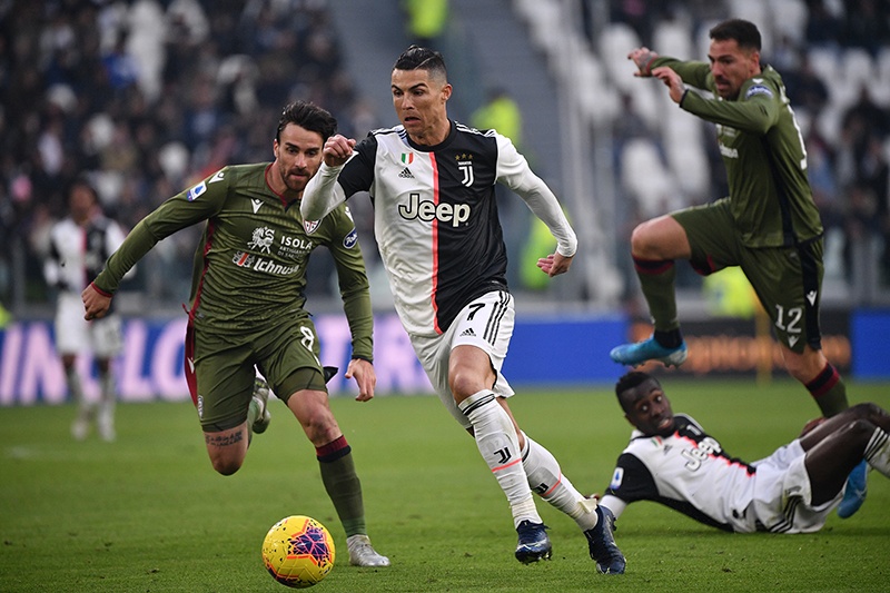 Juventus' Portuguese forward Cristiano Ronaldo outruns defenders during the Italian Serie A football match Juventus vs Cagliari on January 6, 2020 at the Juventus Allianz stadium in Turin. (Photo by Marco Bertorello / AFP)