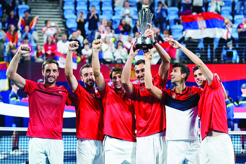 Serbia team celebrate with the trophy after defeating Spain in the final of the ATP Cup tennis tournament in Sydney on January 13, 2020. (Photo by William WEST / AFP) / -- IMAGE RESTRICTED TO EDITORIAL USE - STRICTLY NO COMMERCIAL USE --