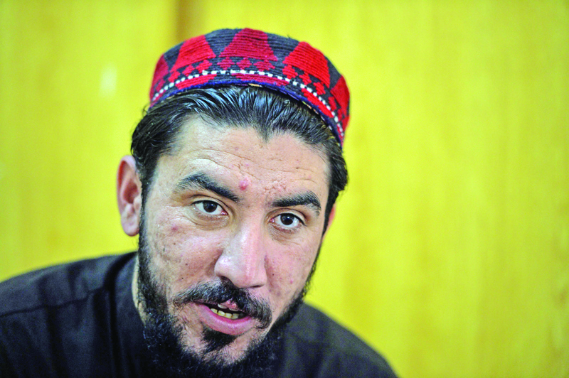 (FILES) In this file photo taken on April 6, 2018, Pakistani tribal leader of the Pashtun Protection Movement (PPM) Manzoor Pashteen takes part in an interview with AFP in Islamabad. - A charismatic Pashtun rights leader who repeatedly accused the powerful military of abuse has been arrested in Pakistan's northwestern city of Peshawar, police said on January 27. (Photo by AAMIR QURESHI / AFP)