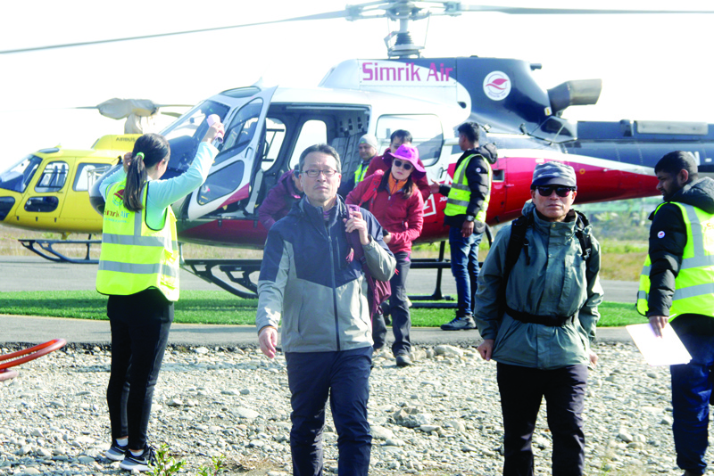 Trekkers arrive after a rescue operation from the Annapurna circuit, at the airport of Pokhara, some 200 km west of Kathmandu, on January 18, 2020. - Four South Koreans and three Nepalis are missing and about 200 people have been rescued after an avalanche hit trekkers on Annapurna, one of the highest mountains in the Himalayas, officials said on January 18. (Photo by KRISHNA MANI BARAL / AFP)