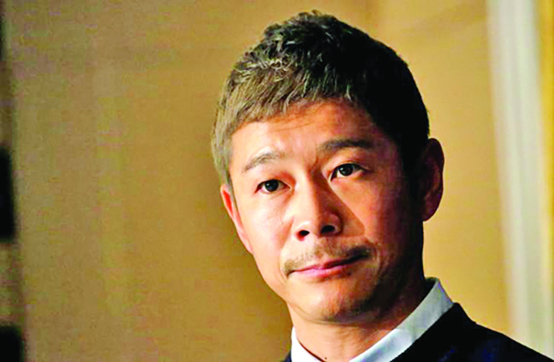 FILE PHOTO: Japanese billionaire Yusaku Maezawa, founder and chief executive of online fashion retailer Zozo, who has been chosen as the first private passenger by SpaceX, attends a news conference at the Foreign Correspondents' Club of Japan in Tokyo, Japan, October 9, 2018.   REUTERS/Toru Hanai/File Photo