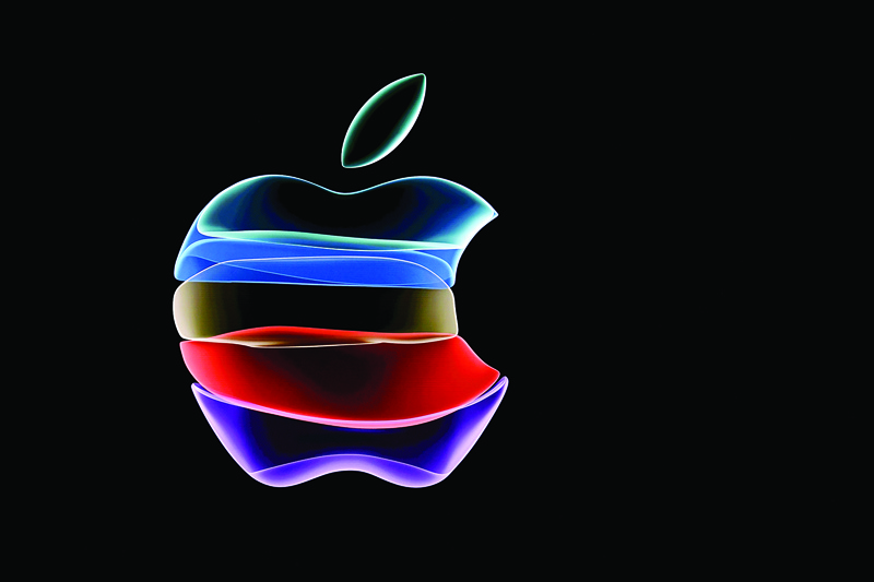 (FILES) In this file photo taken on September 10, 2019 the apple logo is projected on a screen before the start of a product launch event at Apple's headquarters in Cupertino, California. - Apple on January 28, 2020 posted record results for the final three months of last year, powered by sales of iPhones, digital services, and wearables such as AirPods.nNet profit hit an all-time high of $22 billion on record quarterly revenue of $91.8 billion, the California tech giant said. (Photo by Josh Edelson / AFP)