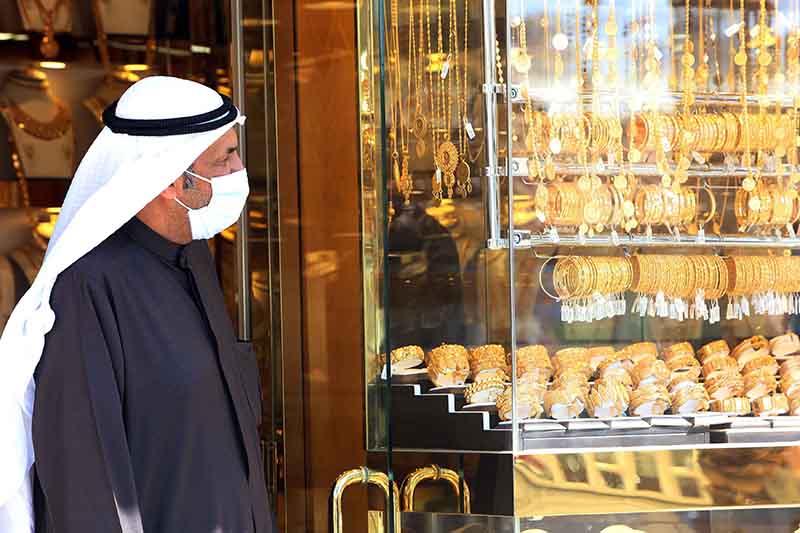 A Kuwaiti man wearing protective mask, shops in a gold marke in Kuwait City on February 27, 2020.