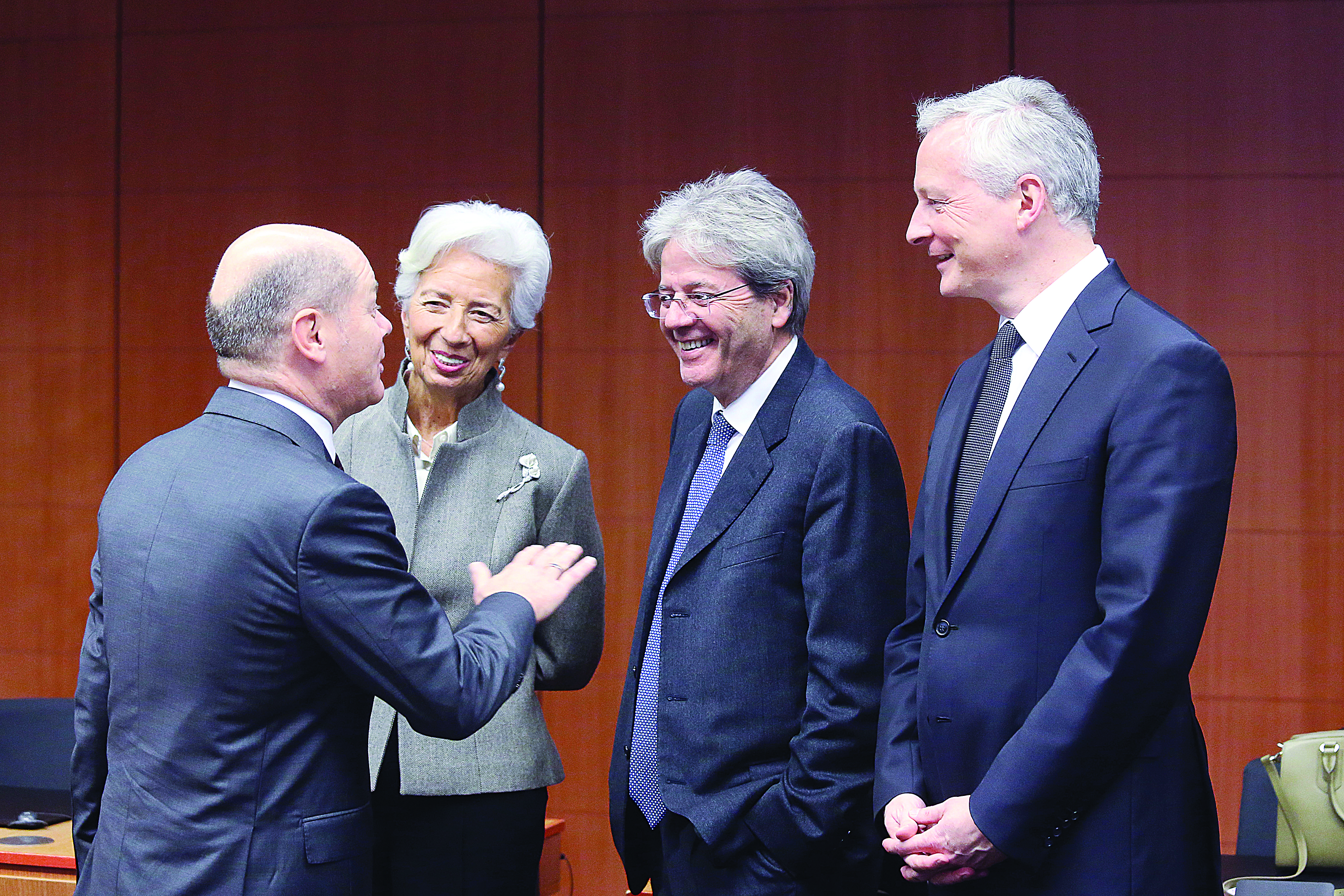 (L-R) German Finance Minister Olaf Scholz, President of the European Central Bank (ECB) Christine Lagarde, European Commissioner for Economy Paolo Gentiloni and French Economy and Finance Minister Bruno Le Maire speak as they attend a Eurogroup meeting at the EU headquarters in Brussels on February 17, 2020. (Photo by FranÁois WALSCHAERTS / POOL / AFP)