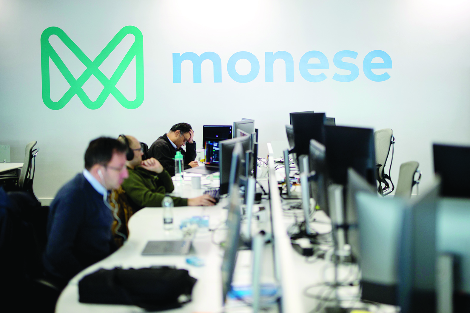 Employees of mobile phone app-based 'neo-bank', Monese work at Monese offices in London on February 7, 2020. - Among Britain's digital app-based challenger banks that increasingly attract city-dwelling rich millennials is Monese, that is wooing customers also long neglected by the country's established lenders.  Koppel's lender Monese has expanded to 31 nations in Europe with two million customers in only five years of operation. (Photo by TOLGA AKMEN / AFP)