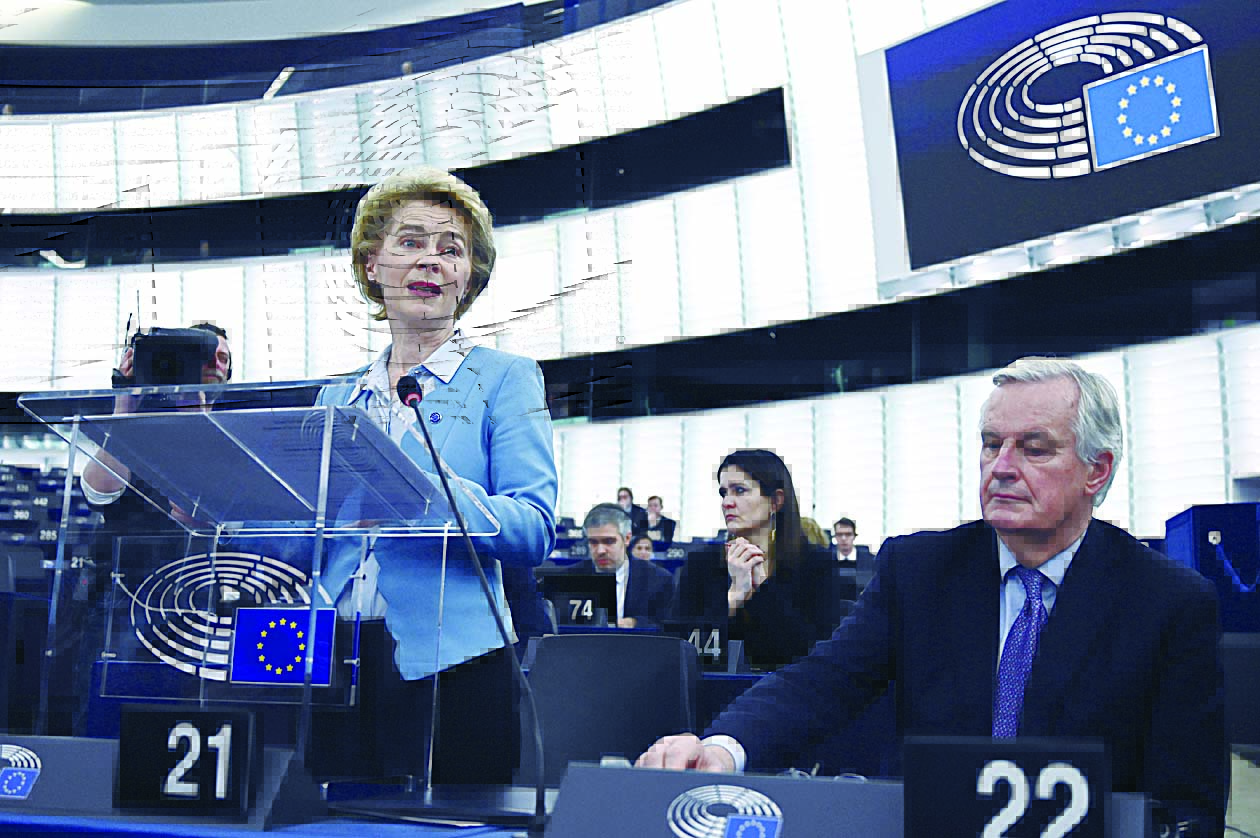 European Commission President Ursula von der Leyen speaks flanked by EU chief Brexit negotiator Michel Barnier during a debate on an ambitious new EU-UK partnership following Brexit, at the European Parliament in Strasbourg, eastern France, on February 11, 2020. (Photo by FREDERICK FLORIN / AFP)