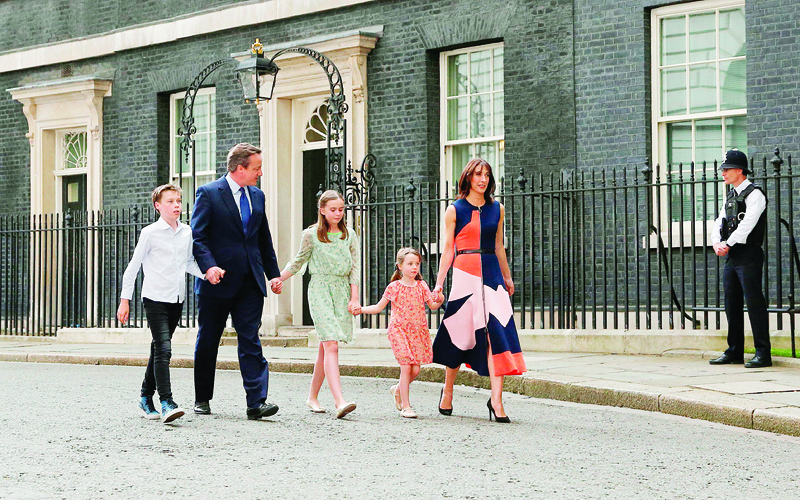 (FILES) In this file photo taken on July 13, 2016 Outgoing British prime minister David Cameron (2L) leaves after speaking outside 10 Downing Street with his family (L-R) son Arthur Elwen, his daughter Nancy Gwen, daughter Florence Rose Endellion and his wife Samantha Cameron in central London, before going to Buckingham Palace to tender his resignation to Queen Elizabeth II. - Britain is set to leave the European Union on at 2300 GMT on January 31, 2020, 43 months after Britons voted in the June 2016 referendum to leave the EU, ending more than four decades of economic, political and legal integration with its closest neighbours. (Photo by Adrian DENNIS / AFP)