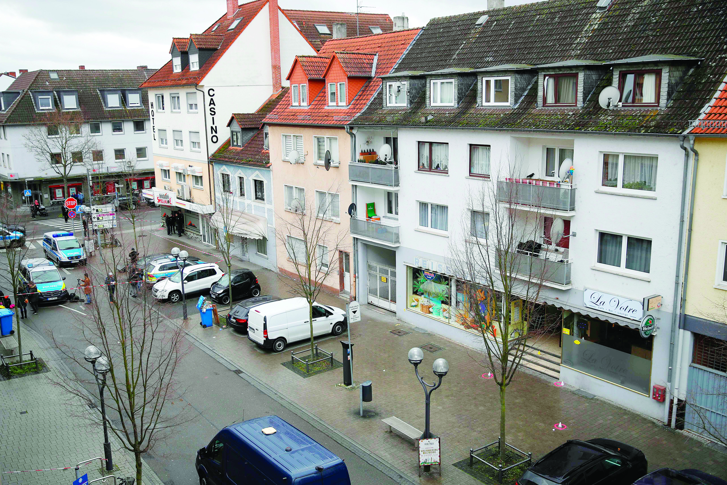 General view of the street where one of the bar (R) has been targeted in a shooting at the Heumarkt in the centre of Hanau, near Frankfurt am Main, western Germany, on February 20, 2020, after at least nine people were killed in two shootings late on February 19, 2020. - The suspect in two shootings in Germany that killed at least nine people was found dead at home, police said on February 20, 2020. At least nine people were killed in two shootings late on February 19 in Hanau, near the German city of Frankfurt. (Photo by Odd ANDERSEN / AFP)
