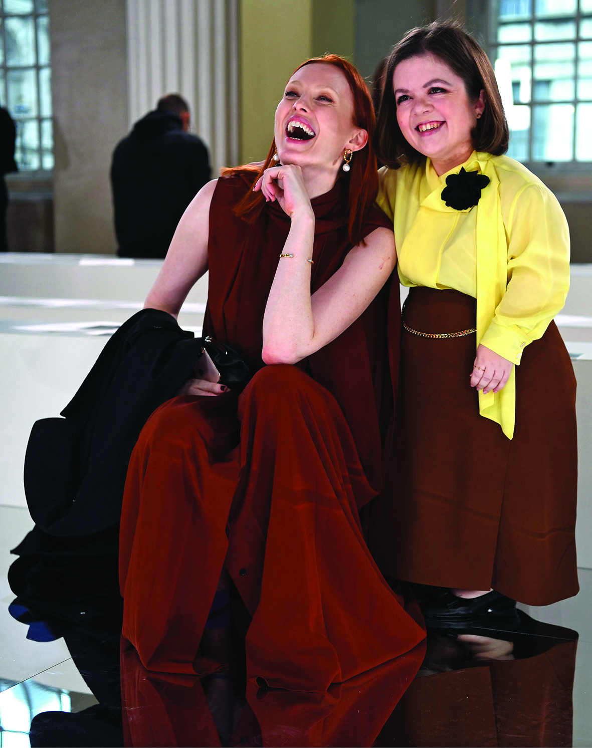 Sinead O'Burke (R) poses for a photograph with British model Karen Elson during London Fashion Week on February 16, 2020. - At a height of 105 centimeters, she challenges the greatest stylists, campaigning for a fashion accessible to all, SinÈad Burke, a 29-year-old Irishwoman, has become a voice that counts in the world of fashion. (Photo by DANIEL LEAL-OLIVAS / AFP) / TO GO WITH AFP STORY BY PAULINE FROISSART