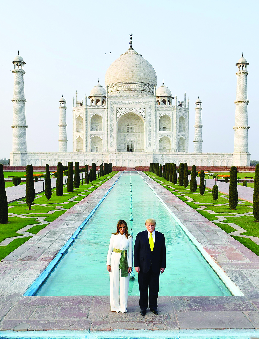 US President Donald Trump and First Lady Melania Trump pose as they visit the Taj Mahal in Agra on February 24, 2020. (Photo by Mandel NGAN / AFP)