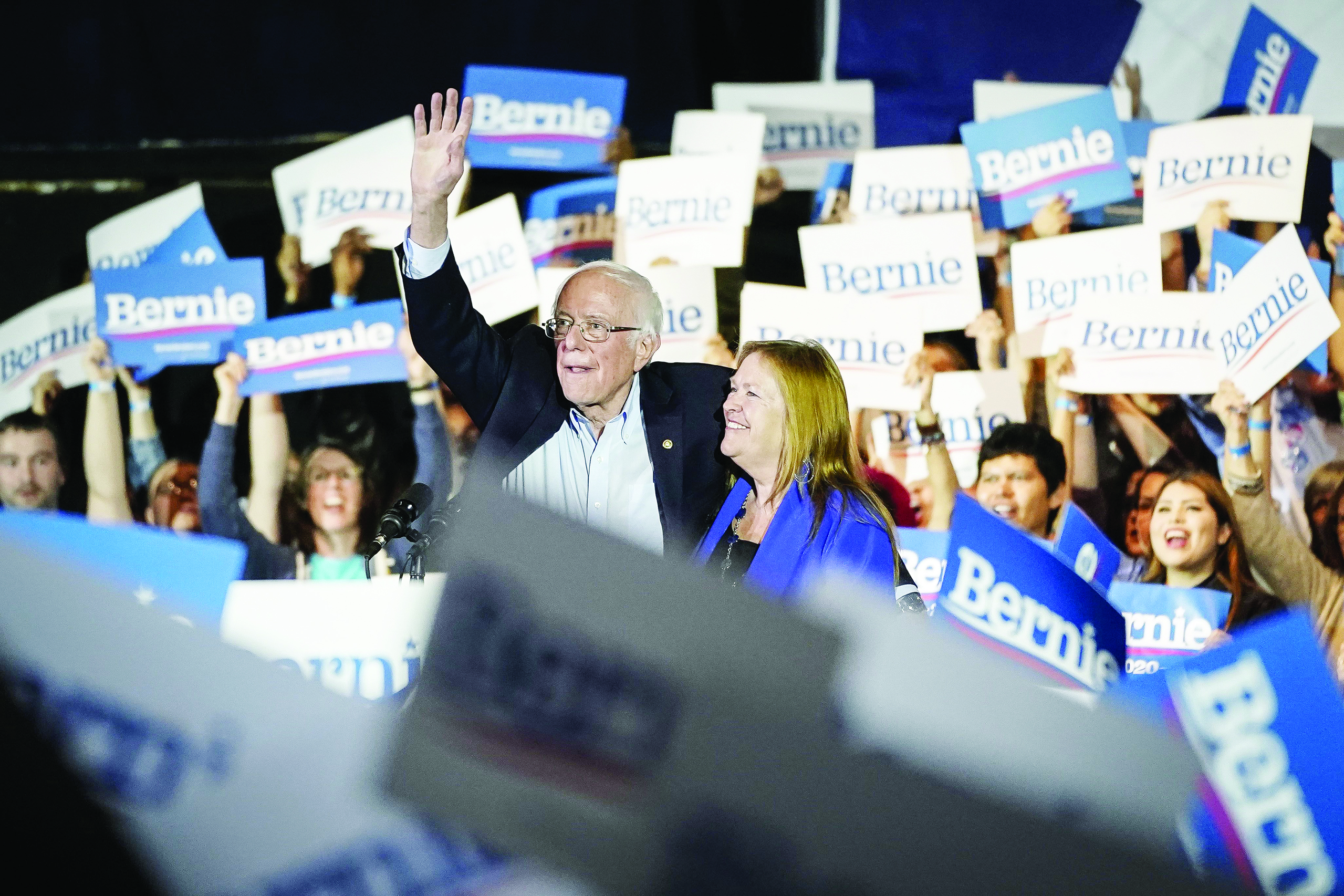 SAN ANTONIO, TX - FEBRUARY 22: Democratic presidential candidate Sen. Bernie Sanders (I-VT) and his wife Jane Sanders wave as they exit the stage after winning the Nevada caucuses during a campaign rally at Cowboys Dancehall on February 22, 2020 in San Antonio, Texas. With early voting underway in Texas, Sanders is holding four rallies in the delegate-rich state this weekend before traveling on to South Carolina. Texas holds their primary on Super Tuesday March 3rd, along with over a dozen other states   Drew Angerer/Getty Images/AFPn== FOR NEWSPAPERS, INTERNET, TELCOS &amp; TELEVISION USE ONLY ==
