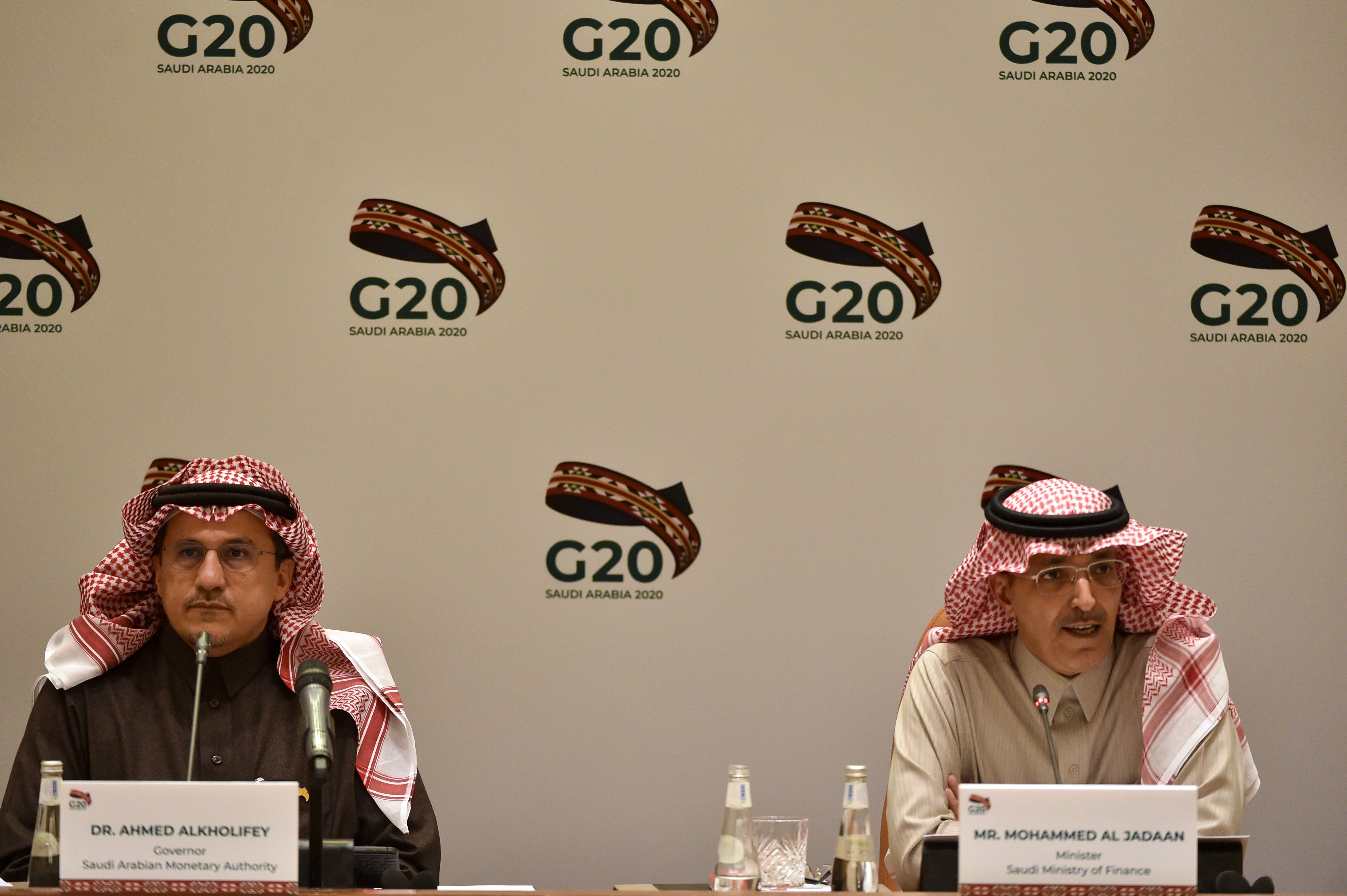 Saudi Minister of Finance Mohammed Al-Jadaan (L) and Ahmed Alkholifey, Governor of the Saudi Arabian Monetary Authority, Central Bank of Saudi Arabia, attend a meeting of Finance ministers and central bank governors of the G20 nations in the Saudi capital Riyadh on February 23, 2020. - The deadly coronavirus epidemic will dent global growth, the IMF warned, as G20 finance ministers and central bank governors weighed its economic ripple effects at a two-day gathering in Riyadh. (Photo by FAYEZ NURELDINE / AFP)
