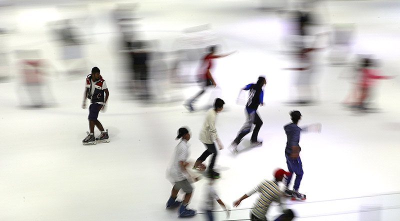 Kuwaitis skate at ice skating rink in Kuwait City on July 30,2015. Most Kuwaitis spend their time traveling or doing indoor activities during the summer when tempretures reach as high as 52 C degrees.
