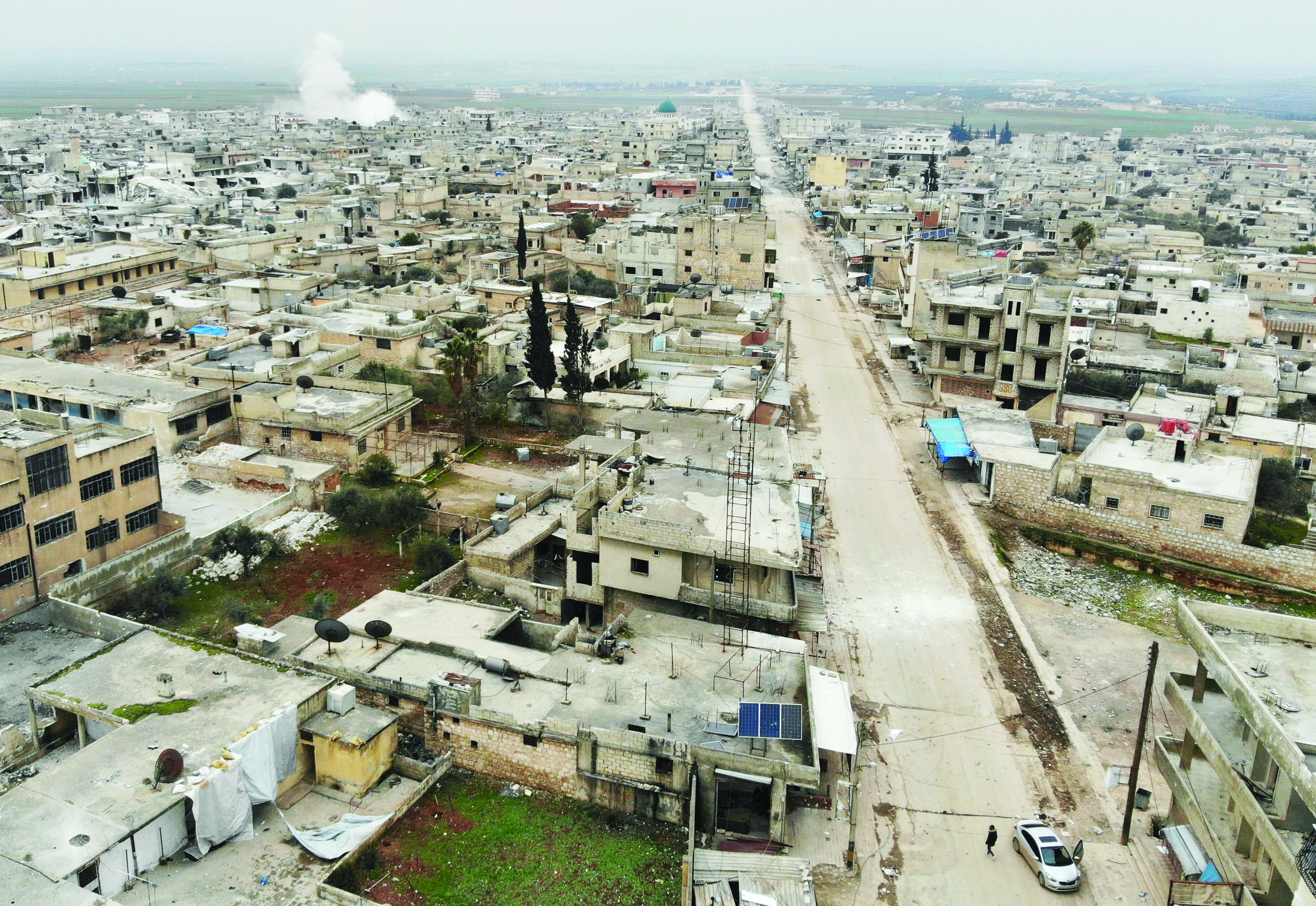 An aerial view shows the village of Maaret al-Naasan in Syria's Idlib province on February 12, 2020 following a weeks-long regime offensive against the country's last major rebel bastion. - Syrian regime forces pushed on with their offensive in the country's northwest, securing areas along a key national highway they seized, as tensions spiralled with Turkey which supports rebel groups. (Photo by Omar HAJ KADOUR / AFP)