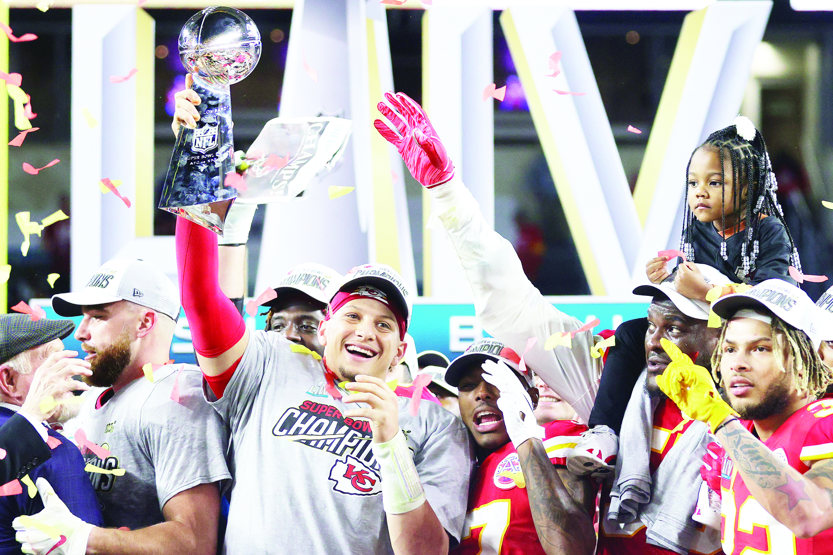 MIAMI, FLORIDA - FEBRUARY 02: Patrick Mahomes #15 of the Kansas City Chiefs raises the Vince Lombardi Trophy after defeating the San Francisco 49ers 31-20 in Super Bowl LIV at Hard Rock Stadium on February 02, 2020 in Miami, Florida.   Jamie Squire/Getty Images/AFP