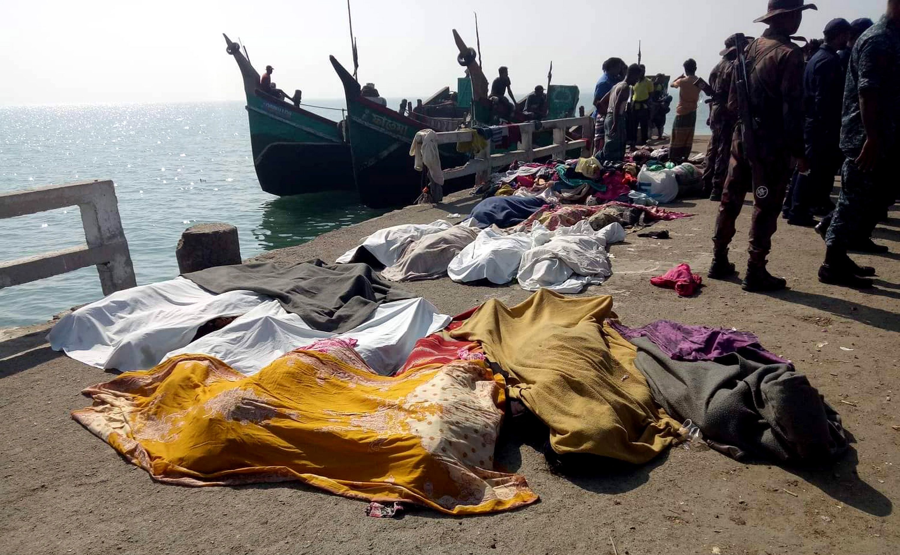 Mandatory Credit: Photo by STRINGER/EPA-EFE/Shutterstock (10553703a)nA view of victims' bodies covered in sheets lying on a quay after a trawler capsized off the Bay of Bengal, in Teknaf, Cox's Bazar District, Bangladesh, 11 February 2020. According to local media reports, at least 15 Rohingya refugees died after a trawler on its way to Malaysia sank off the coast in the Bay of Bengal, near St Martin's Island. Some 65 people were said to have been rescued alive, media added. The victims are said to be mostly women from Rohingya camps located in Teknaf and Ukhia Upazila of Cox's Bazar.nAt least 15 dead after boat carrying Rohingya refugees capsizes off Bangladesh, Teknaf - 11 Feb 2020
