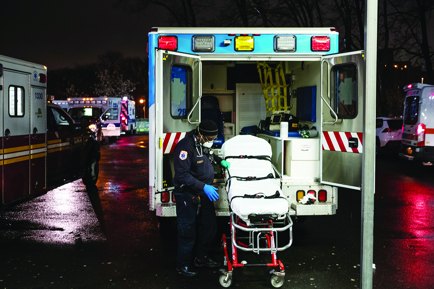 NEW YORK, NY - MARCH 28: EMS personnel outside Emergency Department, St. Barnabas Hospital in the Bronx on March 28, 2020 in New York City. The World Health Organization declared coronavirus (COVID-19) a global pandemic on March 11.   Misha Friedman/Getty Images/AFPn== FOR NEWSPAPERS, INTERNET, TELCOS &amp; TELEVISION USE ONLY ==