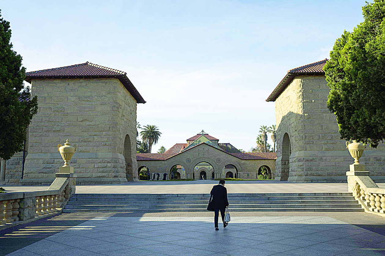 STANFORD, CA - MARCH 09: A person walks towards the main quad during a quiet morning at Stanford University on March 9, 2020 in Stanford, California. Stanford University announced that classes will be held online for the remainder of the winter quarter after a staff member working in a clinic tested positive for the Coronavirus.   Philip Pacheco/Getty Images/AFPn== FOR NEWSPAPERS, INTERNET, TELCOS &amp; TELEVISION USE ONLY ==