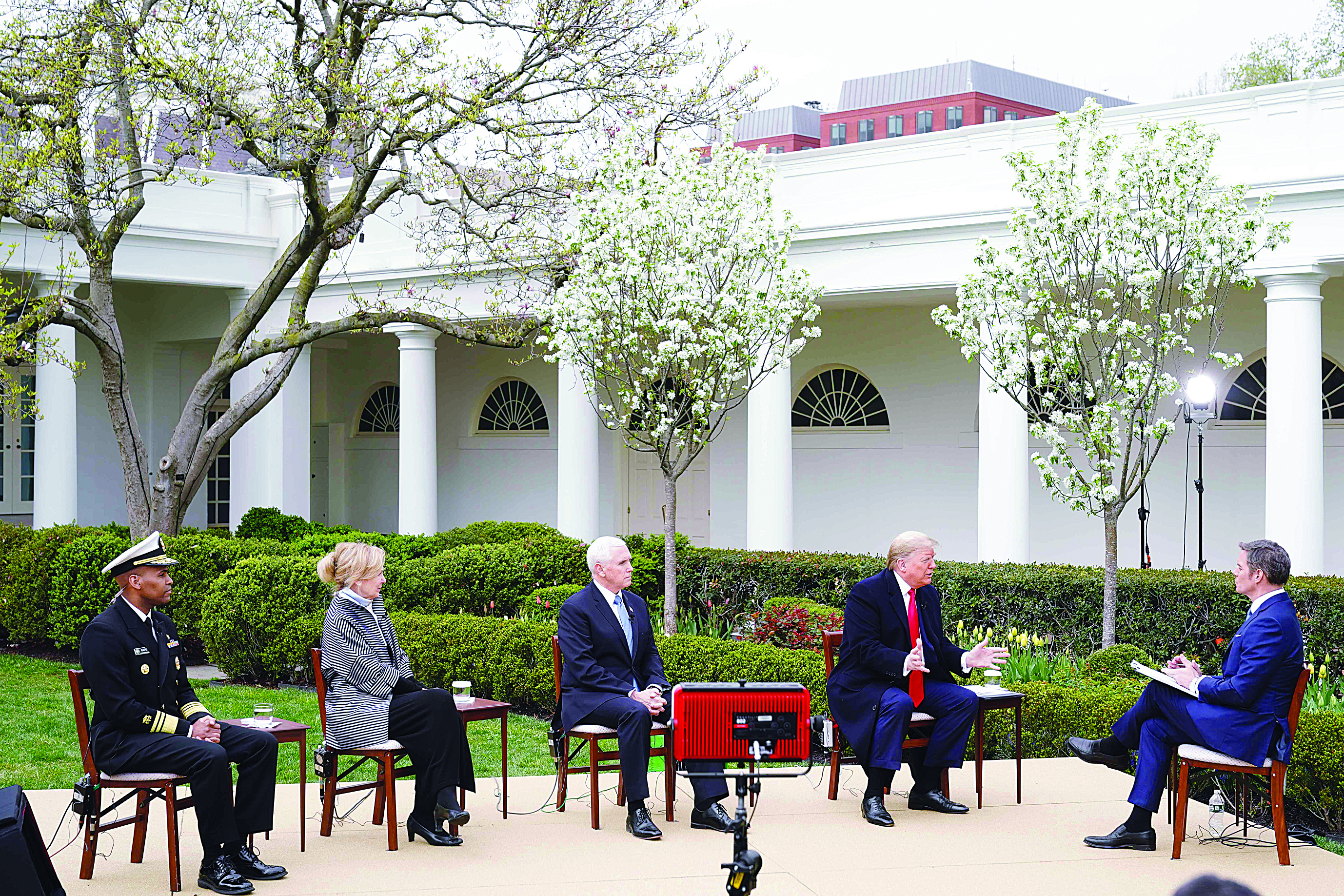 (L-R) US Surgeon General Jerome Adams, Response coordinator for White House Coronavirus Task Force Deborah Birx, US Vice President Mike Pence and President Donald Trump take part in a Fox News virtual town hall meeting with anchor Bill Hemmer, from the Rose Garden of the White House in Washington, DC, on March 24, 2020. (Photo by MANDEL NGAN / AFP)