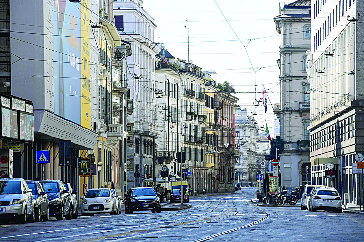A picture taken on March 8, 2020 shows the deserted Via Manzoni in central Milan, after millions of people were placed under forced quarantine in northern Italy as the government approved drastic measures in an attempt to halt the spread of the COVID-19 outbreak, caused by the novel coronavirus that is sweeping the globe. - On top of the forced quarantine of 15 million people in vast areas of northern Italy until April 3, the government has also closed schools, nightclubs and casinos throughout the country, according to the text of the decree published on the government website. With more than 230 fatalities, Italy has recorded the most deaths from the COVID-19 disease of any country outside China, where the outbreak began in December. (Photo by Miguel MEDINA / AFP)