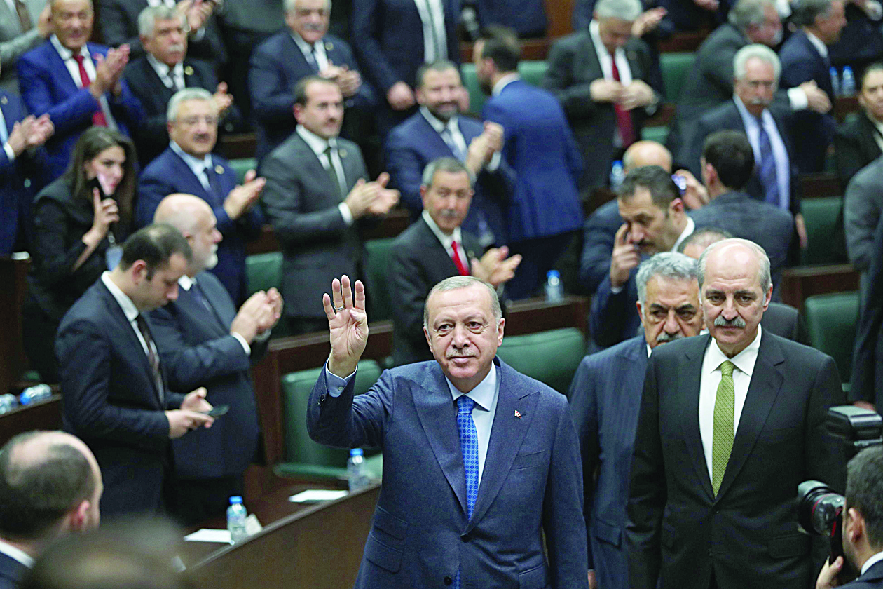 President of Turkey and leader of Justice and Development (AK) Party Recep Tayyip Erdogan (C) waves as he attends his party's group meeting at Grand National Assembly of Turkey in Ankara, Turkey on March 11, 2020. (Photo by Adem ALTAN / AFP)