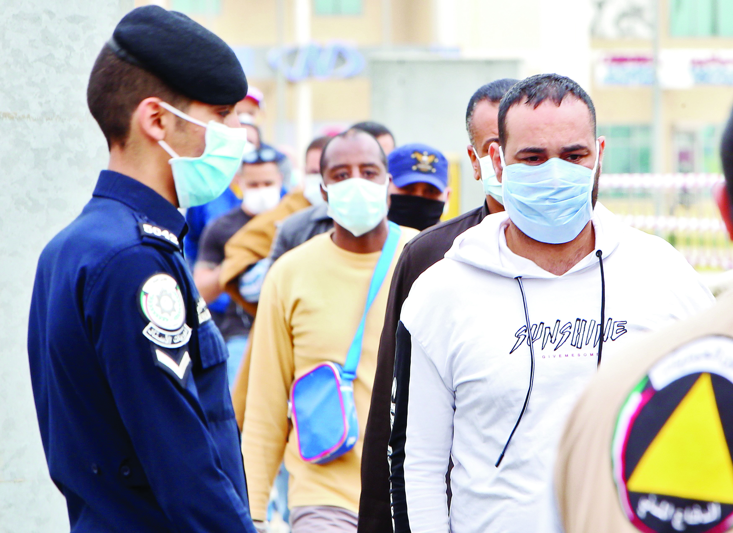 Expatriate workers returning from Egypt, Syria, and Lebanon arrive at a Kuwaiti health ministry containment and screening zone for COVID-19 coronavirus disease in Kuwait City on March 15, 2020. (Photo by YASSER AL-ZAYYAT / AFP)
