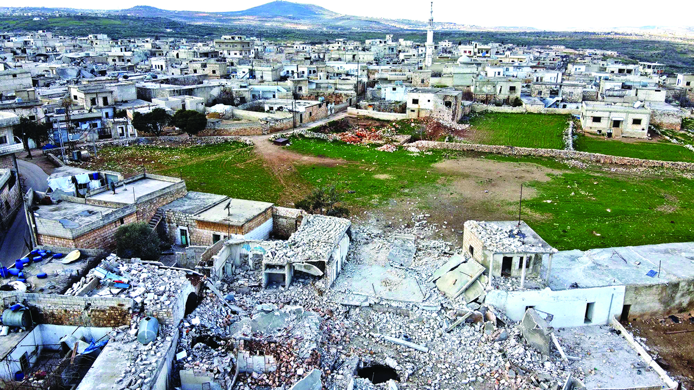 This picture taken on on March 2, 2020 shows an aerial view of destruction in the village of Balyun in the southern part of Syria's northwestern province of Idlib. (Photo by Omar HAJ KADOUR / AFP)