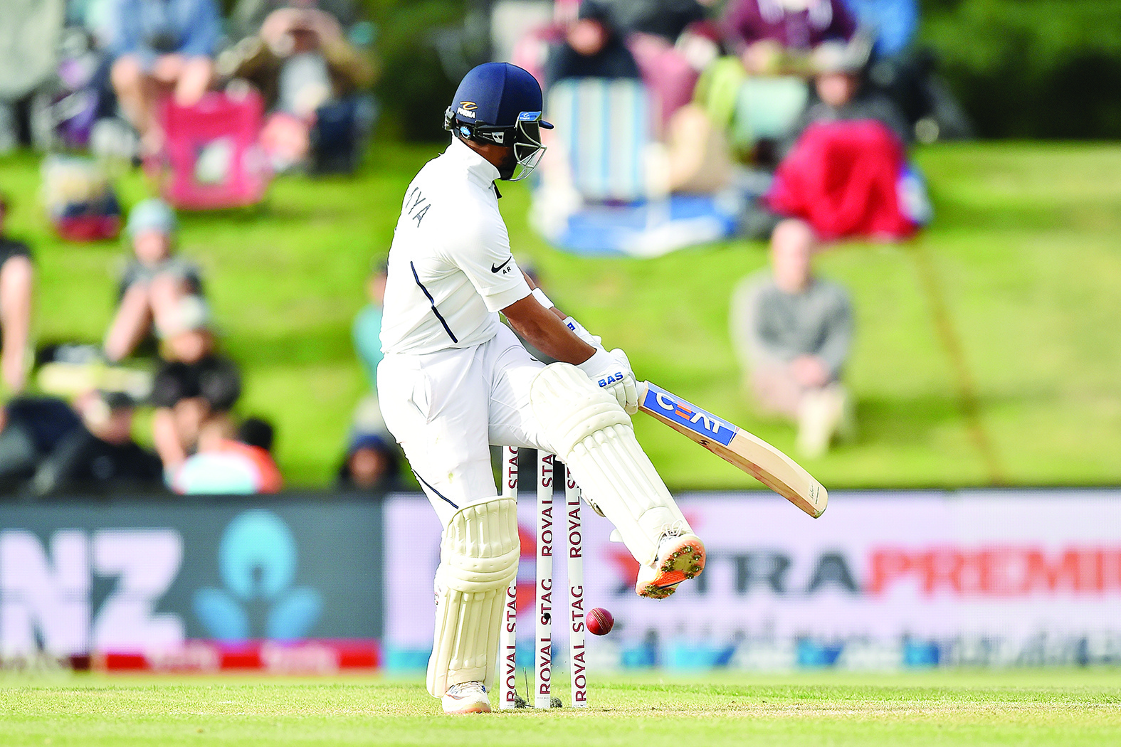 India's Cheteshwar Pujara is clean-bowled on day two of the second Test cricket match between New Zealand and India at the Hagley Oval in Christchurch on March 1, 2020. (Photo by PETER PARKS / AFP)
